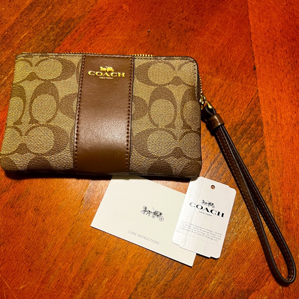 Coach signature canvas with leather trim Corner Zip wristlet is perfectly sized!